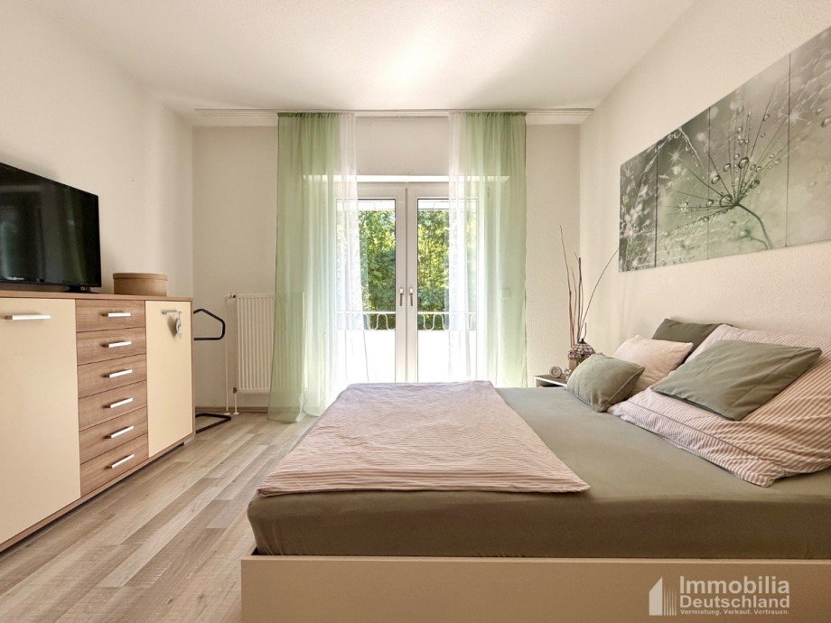 Schlafzimmer mit Zugang auf den Balkon Erdgeschosswohnung Witten